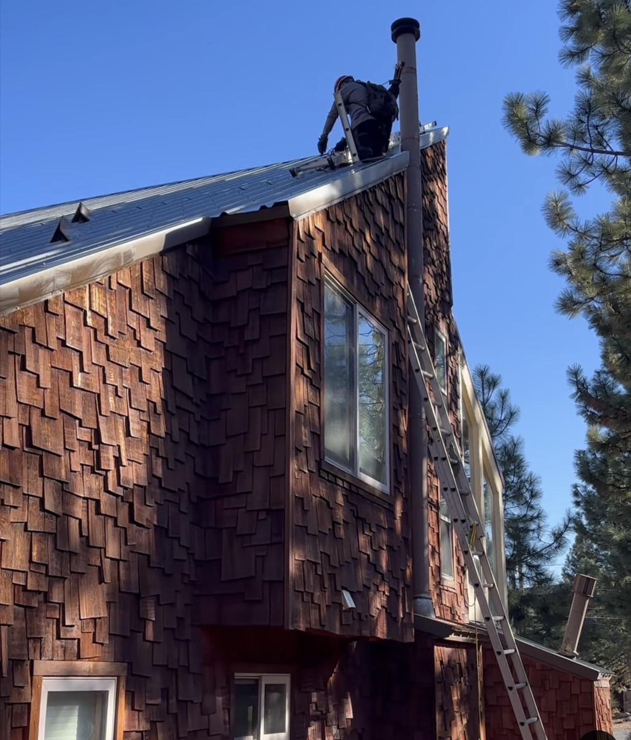 Working above a steep mountain roof.